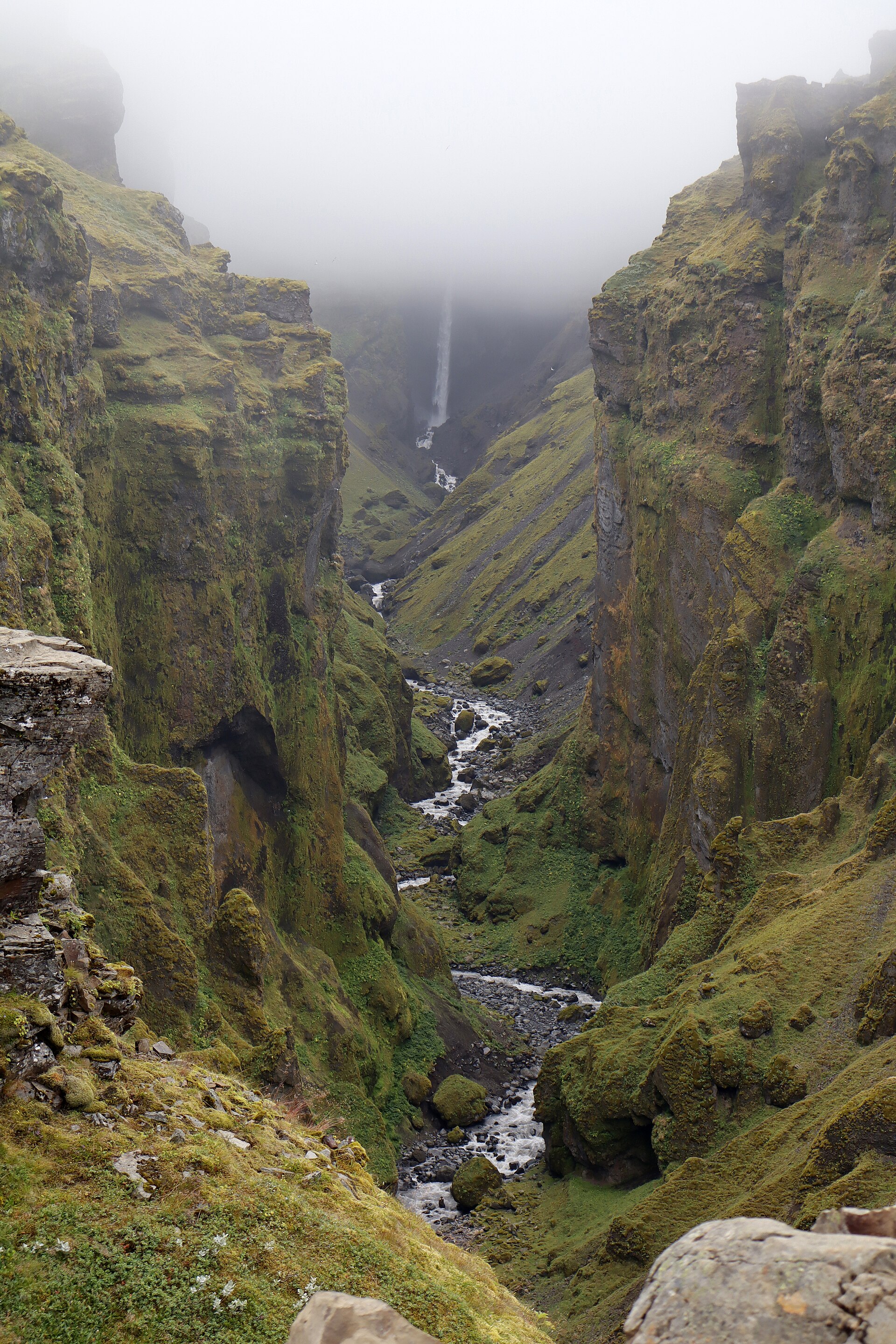 Múlafoss dropping into the canyon head under low fog